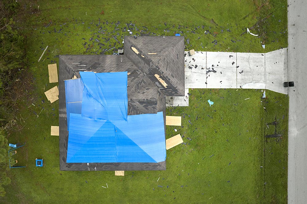 Storm damage on a Fort Worth residential roof before repair by Hart Roofing
