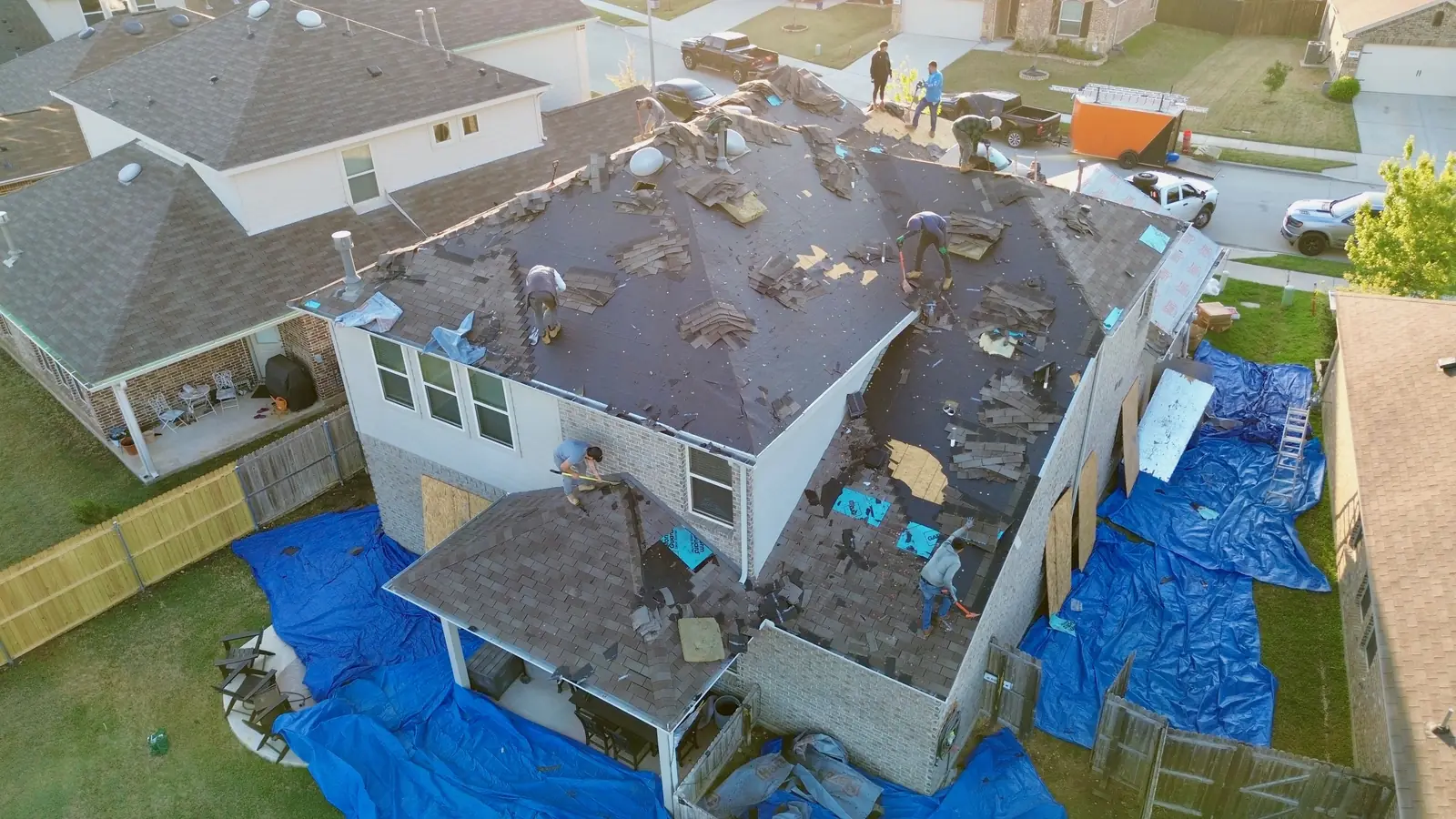 Hart Roofing crew installing a new roof on a home in the Dallas-Fort Worth area